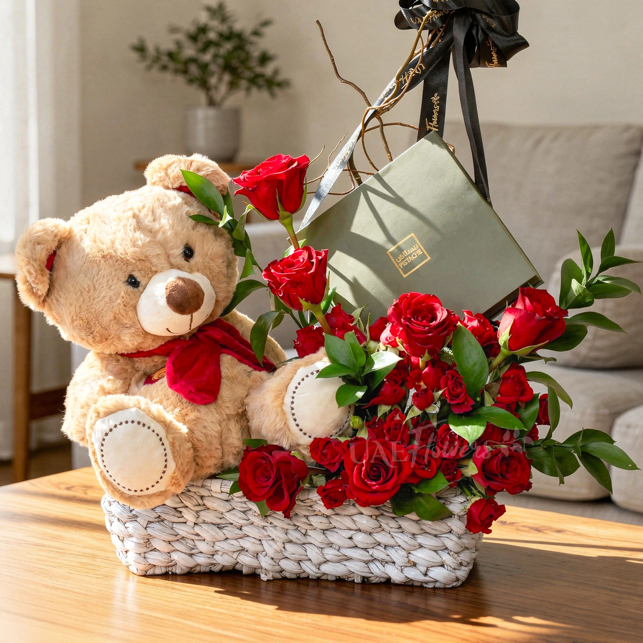 Basket arrangement of 5 red roses, 5 red spray roses, small brown teddy bear and 16 Pcs Pistache Classic Selection Chocolate Box
