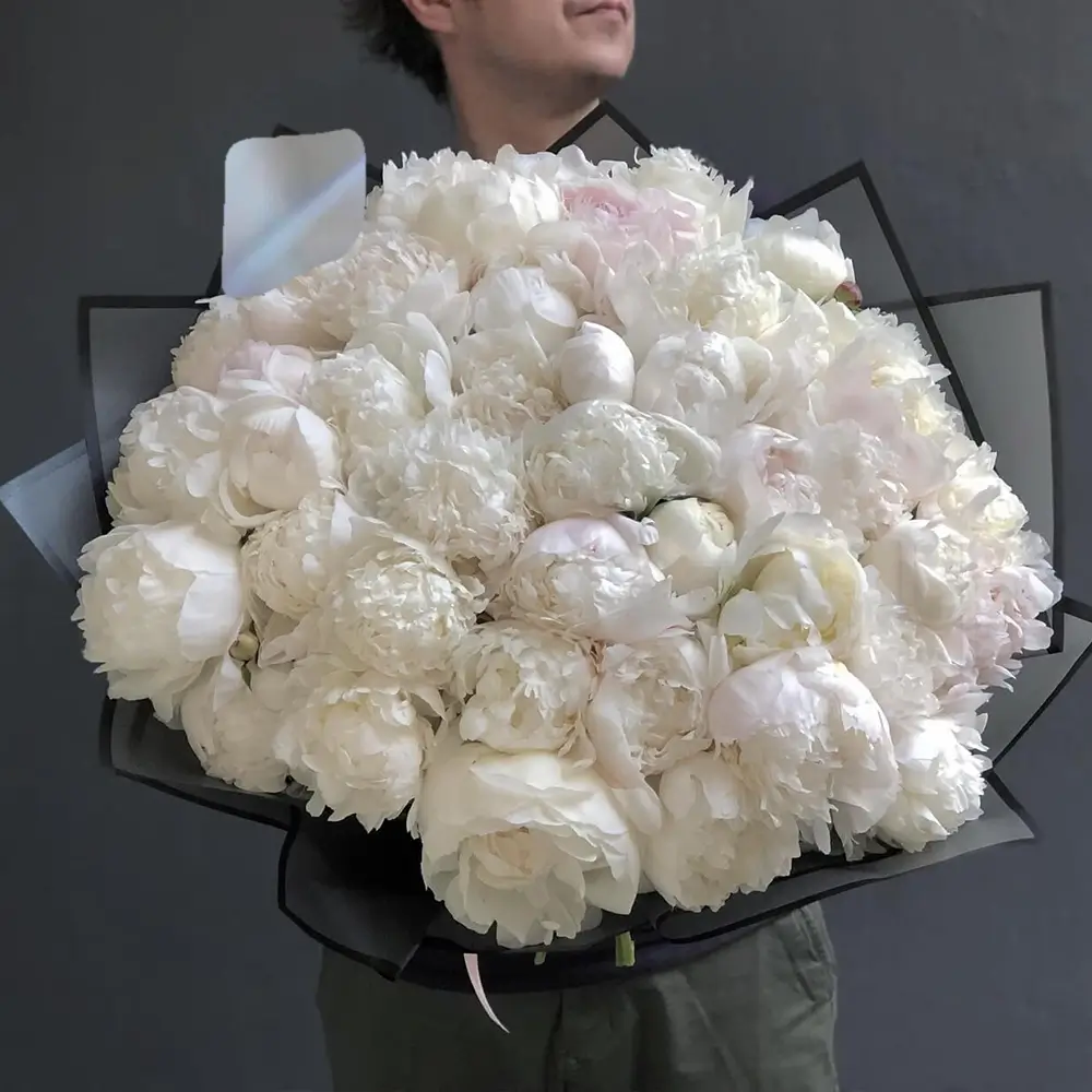 50 white peonies wrapped in brown paper