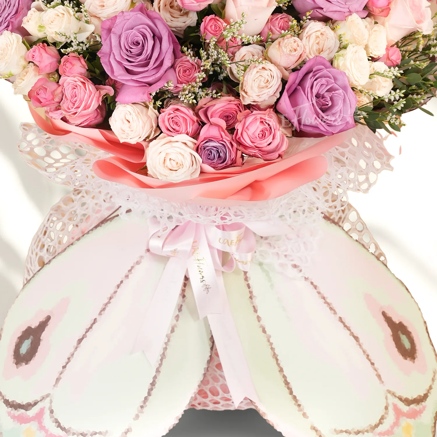 6 purple, 4 pink, and 10 pink and peach spray roses.