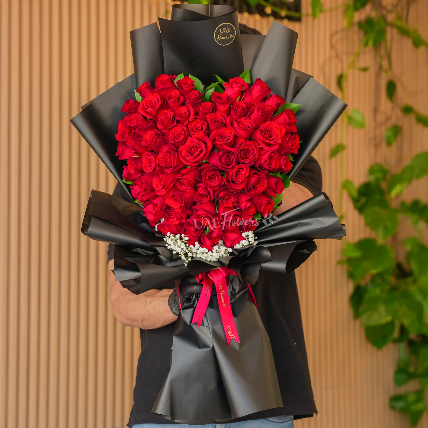 bouquet of 50 red roses in heart shape with baby's breath fillers