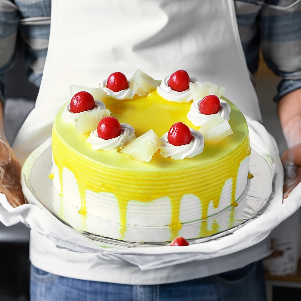 1.5 Kg Exotic Pineapple Cake made with moist sponge,