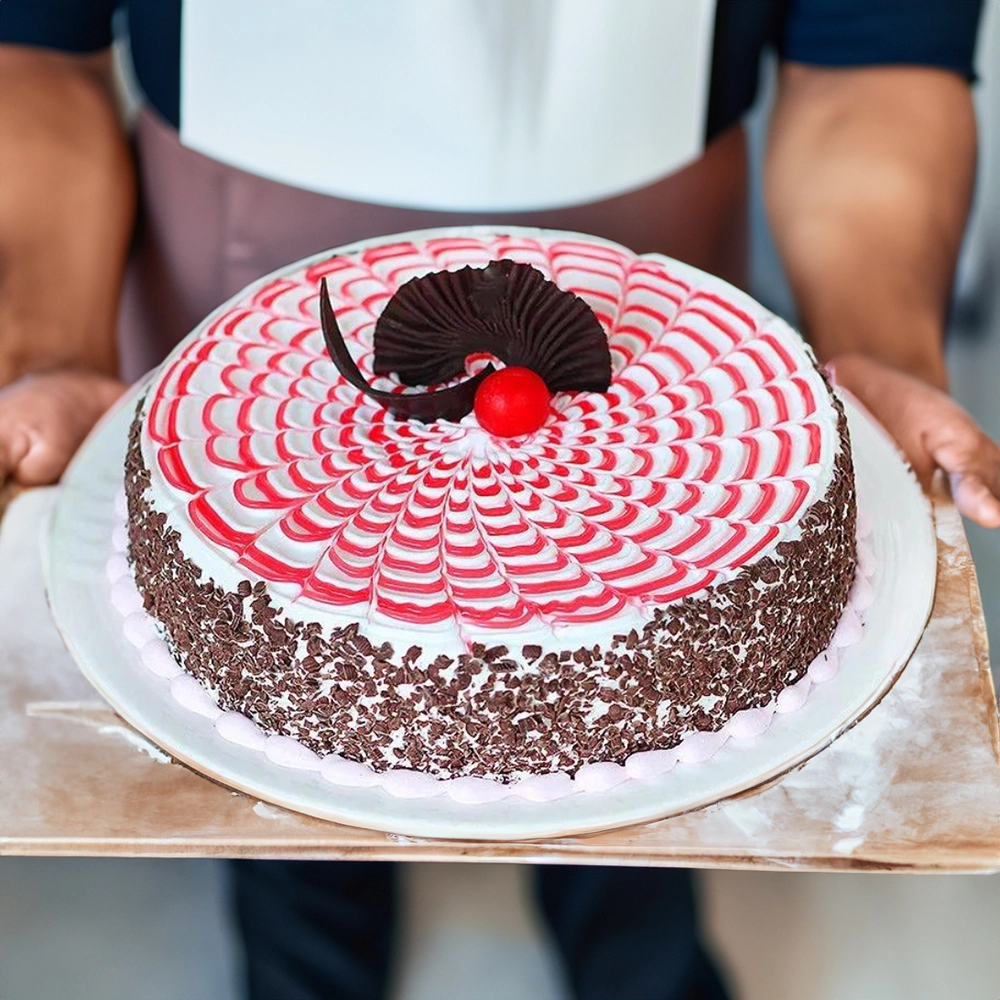 A 1 kg of round strawberry cake