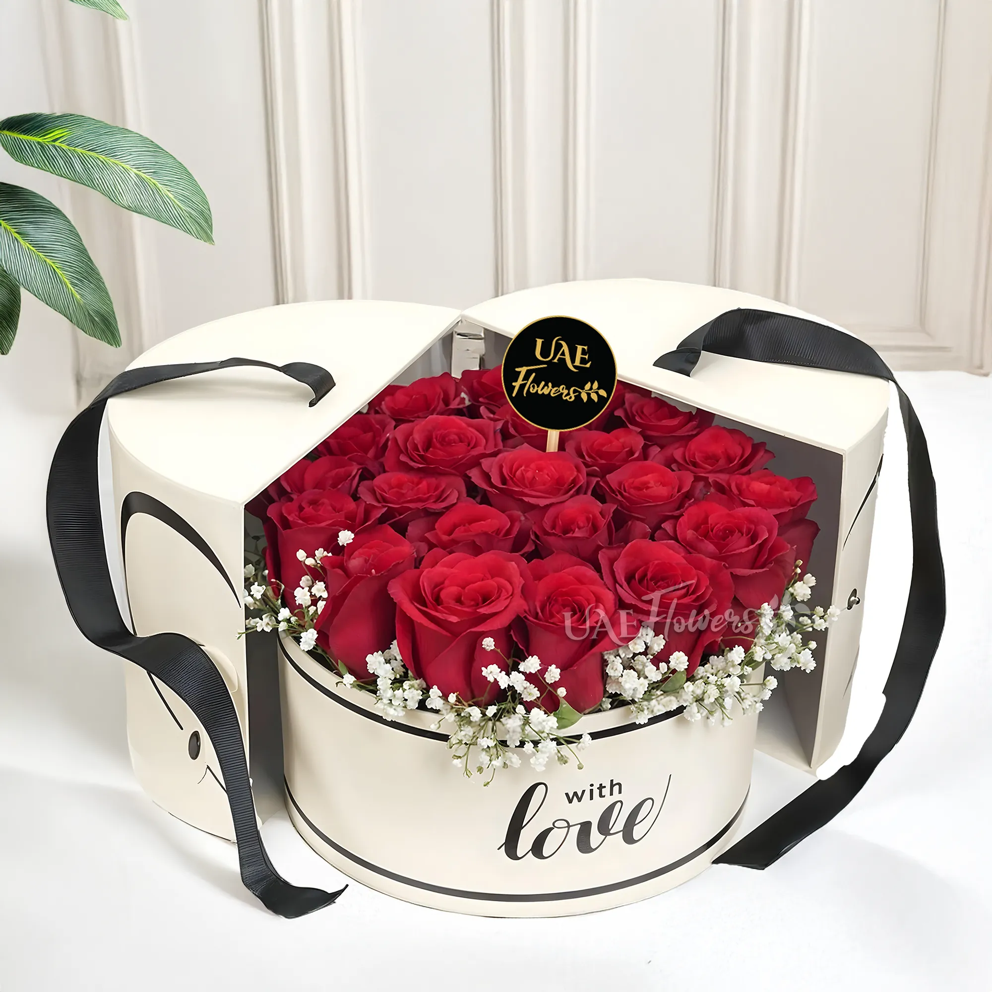 15 red roses with baby's breath arranged in a round box