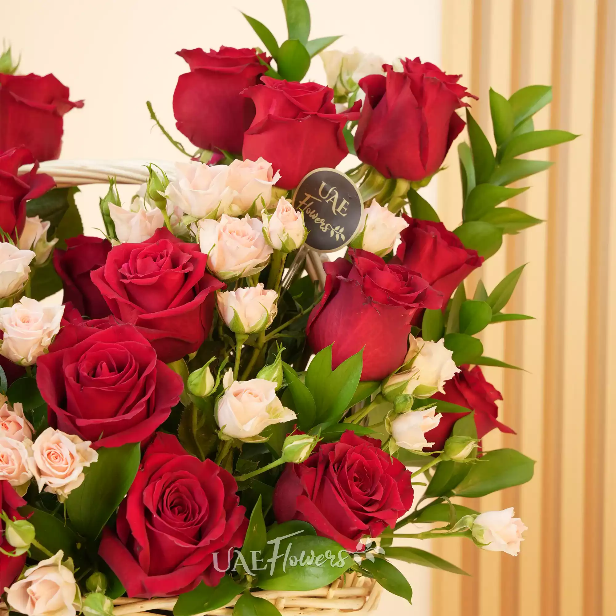 20 red roses, 6 pink spray roses, and green fillers