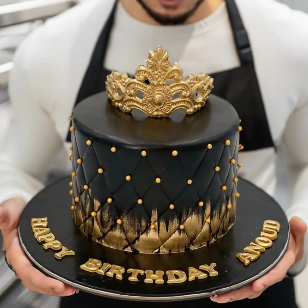 Elegant 3kg black cake topped with a golden crown, ideal for grand celebrations