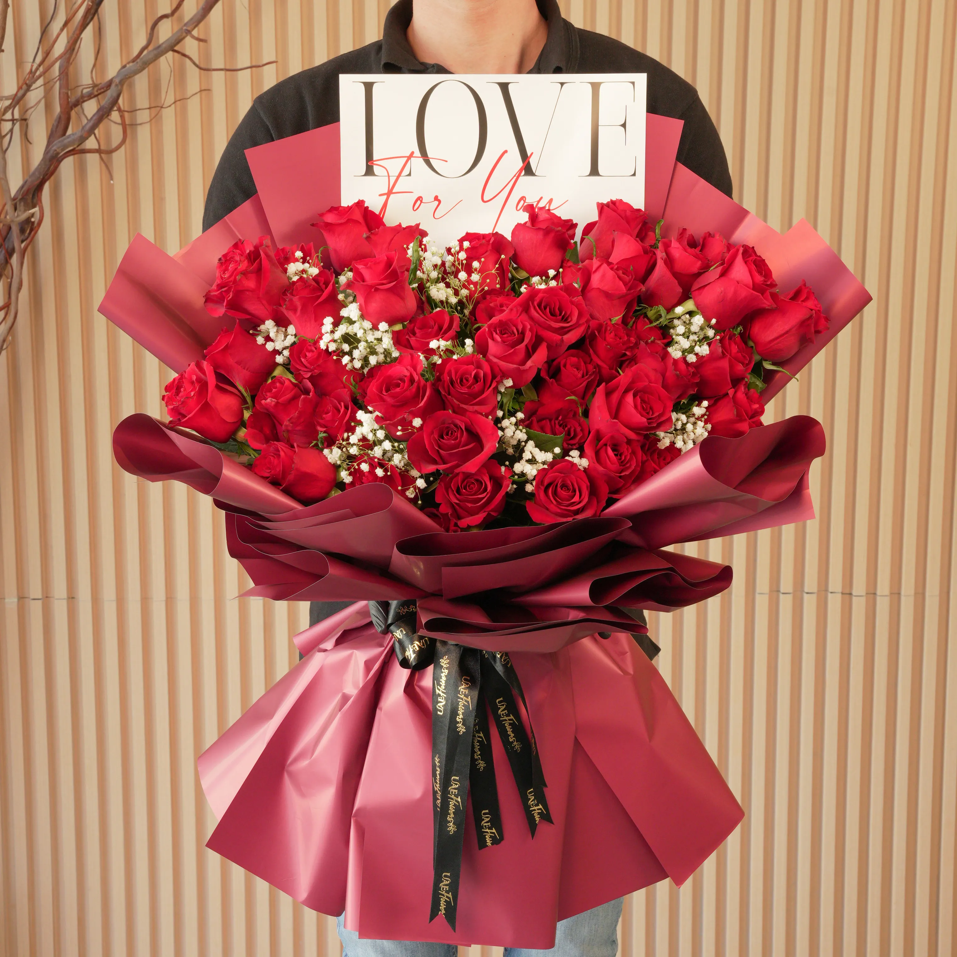 Bouquet of 50 red roses with baby’s breath