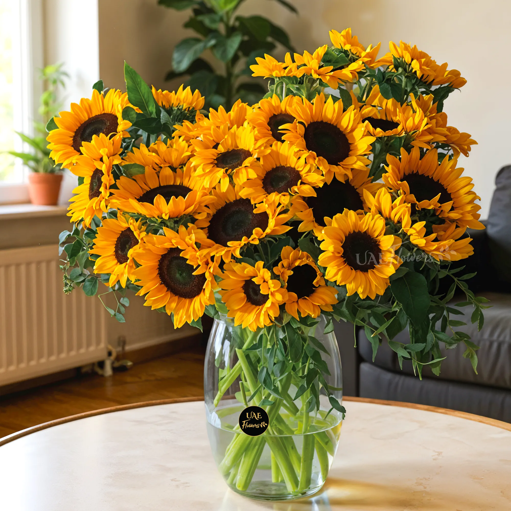 20 bright yellow sunflowers in a crystal glass vase