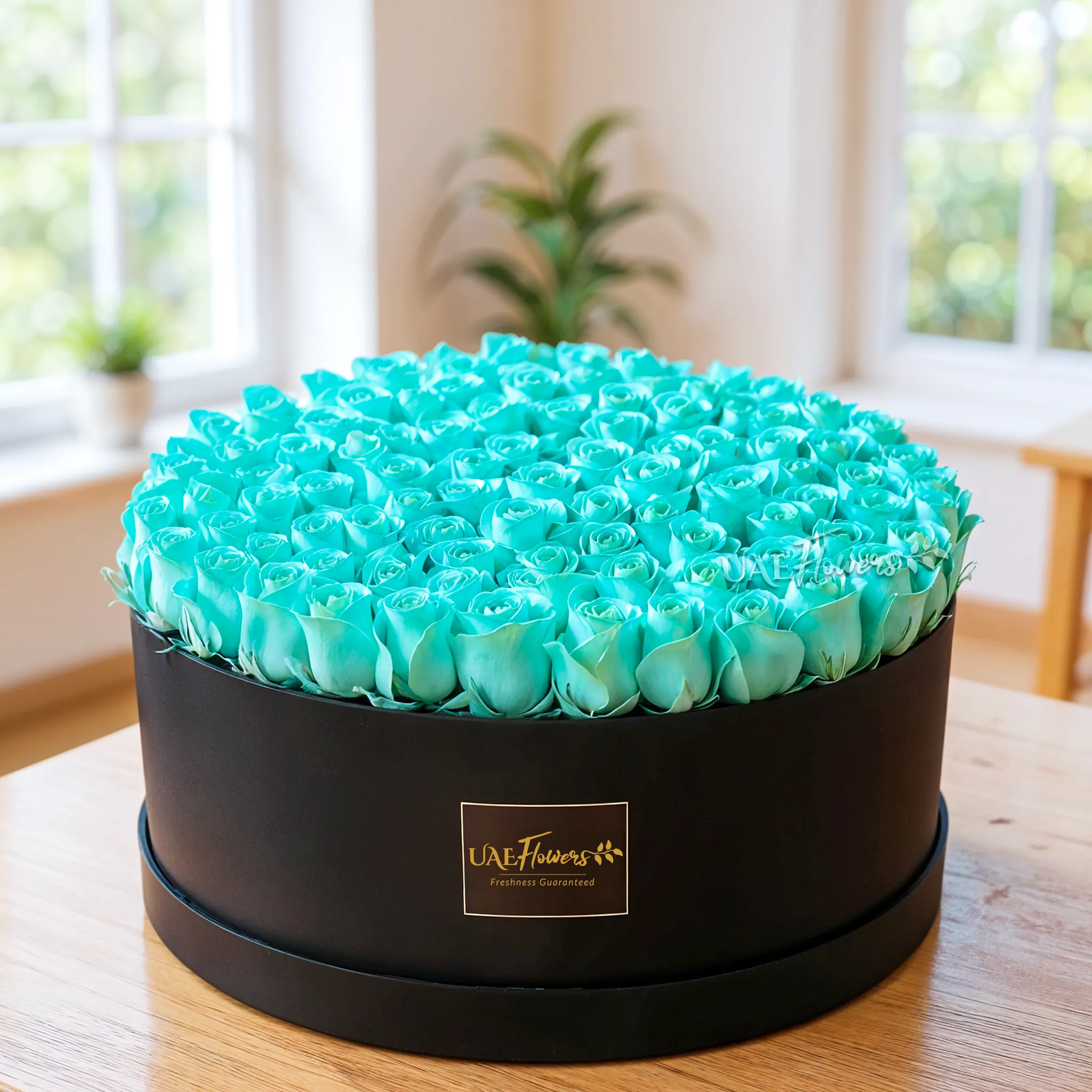 120 sprayed blue roses in a white round box