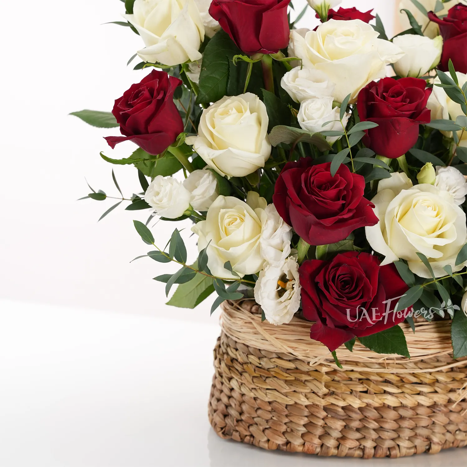 basket of 20 red and white roses with 5 white spray roses and green fillers